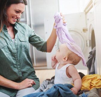 Having fun washing the clothes.